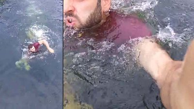 无人机跌落水一瞬间，摄影师跳入湖中游水拯救